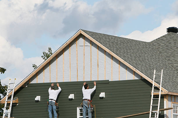 Professional Siding Installation technician working in Butler, IN